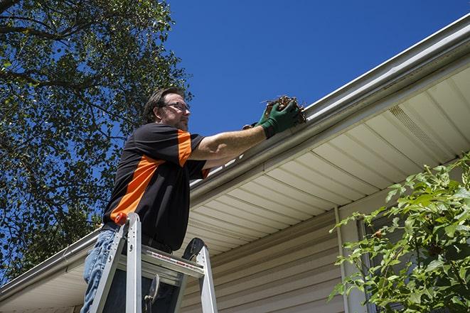 experienced contractor repairing a gutter system in South Daytona FL